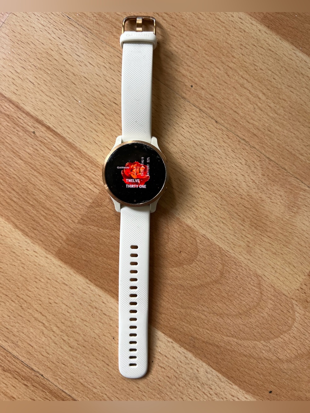 garmin Venu 2S smartwatch with white band and rose gold bezel